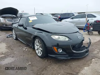 2009 Mazda MX-5 Miata Grand Touring z VIN JM1NC26F590204178, wystawiony jako IAAI lot #41445089 z przebiegiem 98 250 mil mil oraz . Historia ofert i sprzedaży dostępna na DreamBid. Obrazek 1.