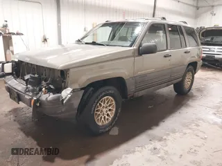 1996 Jeep Grand Cherokee Laredo with VIN 1J4GZ58S5TC182766, listed as a IAAI auction lot 41372356 with 234,390 mi miles. Bid and sale history available at carsss.com. Image 18.
