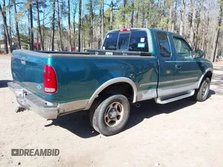 1997 Ford F-150 XL with VIN 1FTDX1860VNA37152, listed as a IAAI auction lot 41713372 with 200,777 mi miles. Bid and sale history available at carsss.com. Image 4.