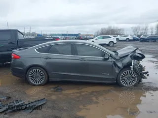 2017 Ford Fusion Hybrid Titanium z VIN 3FA6P0RU6HR279726, wystawiony jako IAAI lot #41736889 z przebiegiem 123 698 mil mil oraz . Historia ofert i sprzedaży dostępna na DreamBid. Obrazek 13.