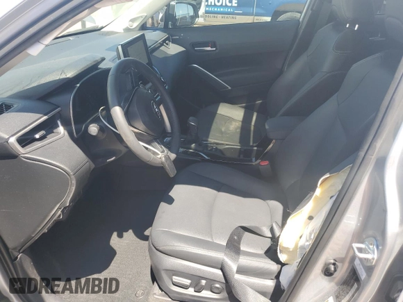 2023 Toyota Corolla Cross XLE with VIN 7MUDAAAG2PV050945, listed as a Copart auction lot 62237465 with 33,036 mi miles and Salvage title. Bid and sale history available at DreamBid. Image 7.