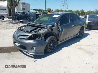 2011 Toyota Corolla L with VIN 2T1BU4EE8BC667772, listed as a IAAI auction lot 41960526 with 219,911 mi miles. Bid and sale history available at carsss.com. Image 2.