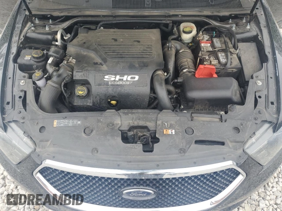 2016 Ford Taurus SHO z VIN 1FAHP2KTXGG155969, wystawiony jako Copart lot #54431405 z przebiegiem 124 040 mil mil oraz Szkoda całkowita • Salvage title. Historia ofert i sprzedaży dostępna na DreamBid. Obrazek 11.