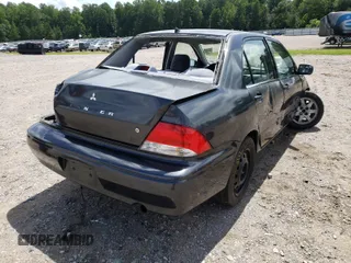 2002 Mitsubishi Lancer LS with VIN JA3AJ36EX2U002399, listed as a Copart auction lot 54435531 with 106,937 mi miles and Salvage Title. Bid and sale history available at carsss.com. Image 4.