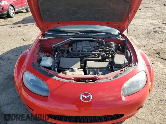 2006 Mazda MX-5 Miata Touring z VIN JM1NC25F360110572, wystawiony jako Copart lot #50555765 z przebiegiem 166 785 mil mil oraz Czysty tytuł • Clean title. Historia ofert i sprzedaży dostępna na DreamBid. Obrazek 11.