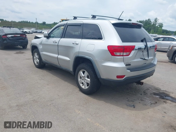 2011 Jeep Grand Cherokee Laredo with VIN 1J4RR4GG3BC734683, listed as a IAAI auction lot 42656716 with 151,220 mi miles and . Bid and sale history available at DreamBid. Image 3.