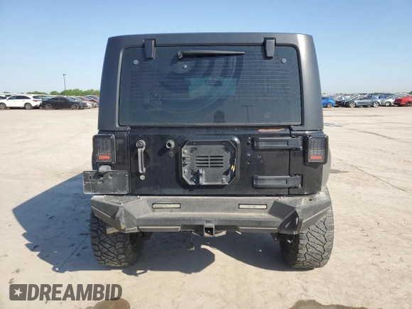2013 Jeep Wrangler Unlimited Freedom z VIN 1C4BJWDG0DL513902, wystawiony jako Copart lot #52045975 z przebiegiem 166 827 mil mil oraz Szkoda całkowita • Salvage title. Historia ofert i sprzedaży dostępna na DreamBid. Obrazek 6.