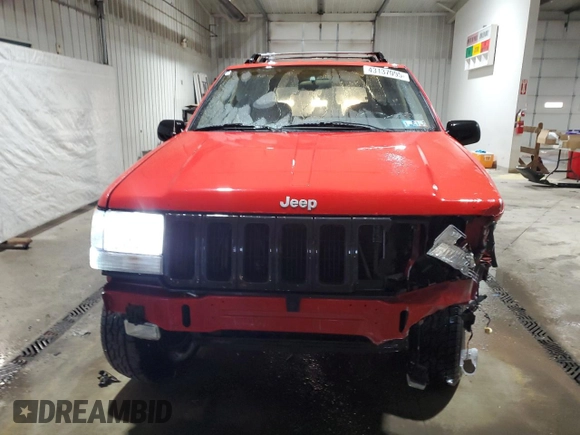 1997 Jeep Grand Cherokee Laredo with VIN 1J4GZ58Y5VC674687, listed as a Copart auction lot 43137095 with 173,228 mi miles and Salvage Title. Bid and sale history available at carsss.com. Image 5.