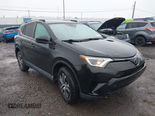 2018 Toyota RAV4 LE with VIN 2T3BFREV2JW788700, listed as a IAAI auction lot 41986212 with 87,704 mi miles. Bid and sale history available at carsss.com. Image 6.