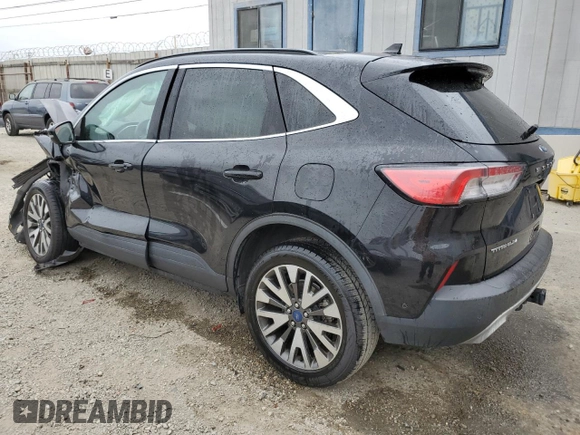 2020 Ford Escape Titanium with VIN 1FMCU9J97LUA59056, listed as a Copart auction lot 58445885 with Not provided miles and Salvage title. Bid and sale history available at DreamBid. Image 2.