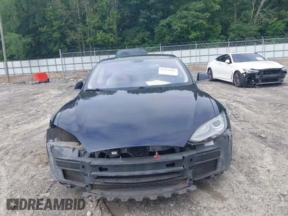 2014 Tesla Model S 60 z VIN 5YJSA1H17EFP33860, wystawiony jako IAAI lot #42471432 z przebiegiem 142 045 mil mil oraz . Historia ofert i sprzedaży dostępna na DreamBid. Obrazek 13.