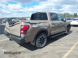 2021 Nissan Titan Pro-4X with VIN 1N6AA1ED4MN531369, listed as a IAAI auction lot 40597122 with 32,161 mi miles and . Bid and sale history available at DreamBid. Image 4.