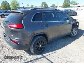 2016 Jeep Cherokee Latitude z VIN 1C4PJLCB5GW264607, wystawiony jako IAAI lot #42275637 z przebiegiem 64 264 mil mil oraz . Historia ofert i sprzedaży dostępna na DreamBid. Obrazek 4.