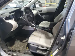 2023 Toyota Corolla Cross LE z VIN 7MUBAAAG4PV042580, wystawiony jako Copart lot #60788025 z przebiegiem 59 576 mil mil oraz Szkoda całkowita • Salvage title. Historia ofert i sprzedaży dostępna na DreamBid. Obrazek 7.