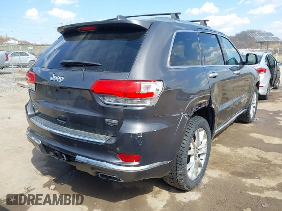 2014 Jeep Grand Cherokee Summit with VIN 1C4RJFJM5EC377129, listed as a IAAI auction lot 41763932 with 187,561 mi miles and . Bid and sale history available at DreamBid. Image 4.