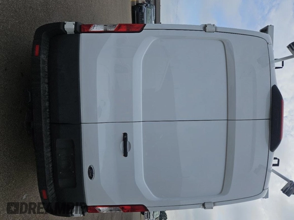 2023 Ford Transit Cargo z VIN 1FTBR1X86PKC02291, wystawiony jako IAAI lot #42791621 z przebiegiem 32 389 mil mil oraz . Historia ofert i sprzedaży dostępna na DreamBid. Obrazek 1.