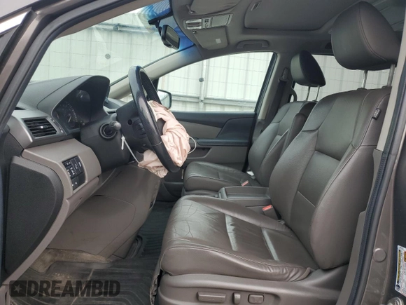 2012 Honda Odyssey Touring with VIN 5FNRL5H94CB109257, listed as a Copart auction lot 59636075 with 107,543 mi miles and Salvage title. Bid and sale history available at DreamBid. Image 7.