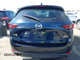2020 Mazda CX-5 Grand Touring with VIN JM3KFADM6L1830093, listed as a IAAI auction lot 41699672 with 66,769 mi miles. Bid and sale history available at carsss.com. Image 17.
