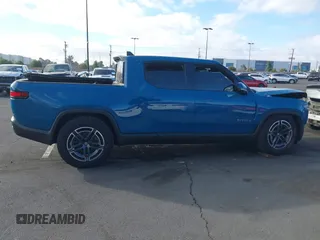 2025 Rivian R1T Adventure z VIN 7FCTGBAA9SN035986, wystawiony jako IAAI lot #41510257 z przebiegiem 2 102 mil mil oraz . Historia ofert i sprzedaży dostępna na DreamBid. Obrazek 14.