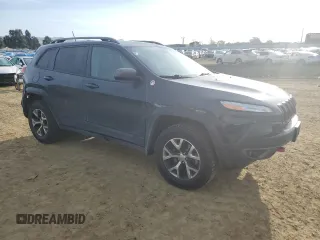 2017 Jeep Cherokee Trailhawk L Plus with VIN 1C4PJMBB1HW518788, listed as a Copart auction lot 49539005 with 237,662 mi miles and Salvage Title. Bid and sale history available at carsss.com. Image 4.