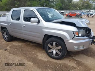 2014 Honda Ridgeline SE with VIN 5FPYK1F62EB013329, listed as a IAAI auction lot 41876728 with 127,014 mi miles. Bid and sale history available at carsss.com. Image 1.