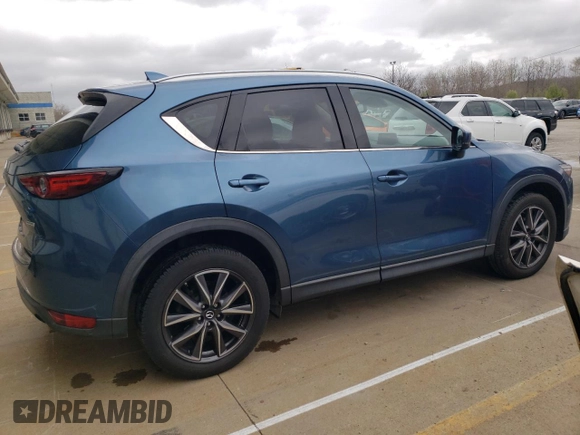 2018 Mazda CX-5 Grand Touring with VIN JM3KFADM8J1351624, listed as a Copart auction lot 50965465 with 66,210 mi miles and Salvage Title. Bid and sale history available at DreamBid. Image 3.