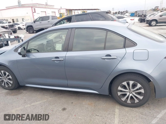 2022 Toyota Corolla Hybrid LE with VIN JTDEAMDE4NJ041913, listed as a IAAI auction lot 41883490 with 23,063 mi miles. Bid and sale history available at carsss.com. Image 14.