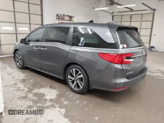2021 Honda Odyssey Touring with VIN 5FNRL6H86MB026038, listed as a IAAI auction lot 41735249 with 68,480 mi miles. Bid and sale history available at carsss.com. Image 3.