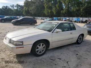 2001 Cadillac Eldorado Touring ETC z VIN 1G6ET12931B103758, wystawiony jako Copart lot #73787764 z przebiegiem Nie podano mil oraz Szkody całkowita. Historia ofert i sprzedaży dostępna na DreamBid. Obrazek 1.