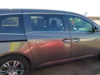 2011 Honda Odyssey EX-L with VIN 5FNRL5H6XBB083980, listed as a IAAI auction lot 42100308 with 191,361 mi miles and . Bid and sale history available at carsss.com. Image 13.