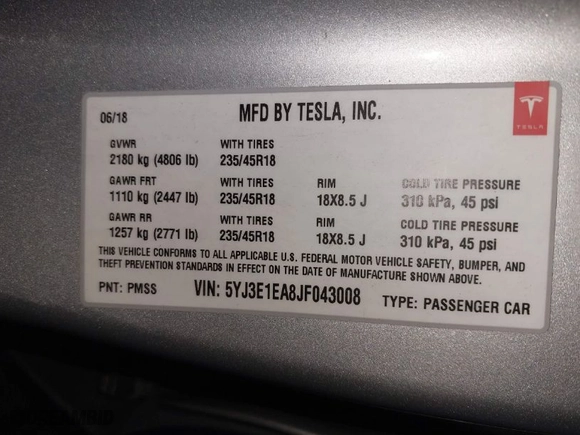 2018 Tesla Model 3 Long Range Battery with VIN 5YJ3E1EA8JF043008, listed as a IAAI auction lot 41002318 with 100,582 mi miles. Bid and sale history available at carsss.com. Image 9.