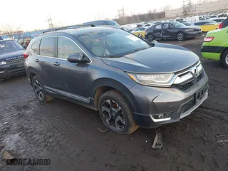2017 Honda CR-V Touring with VIN 2HKRW2H94HH617081, listed as a IAAI auction lot 41294254 with 145,140 mi miles. Bid and sale history available at carsss.com. Image 1.