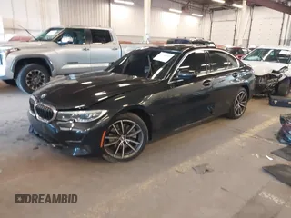 2021 BMW 3 Series 330i with VIN 3MW5R1J06M8C17805, listed as a IAAI auction lot 41736509 with 60,811 mi miles. Bid and sale history available at carsss.com. Image 2.
