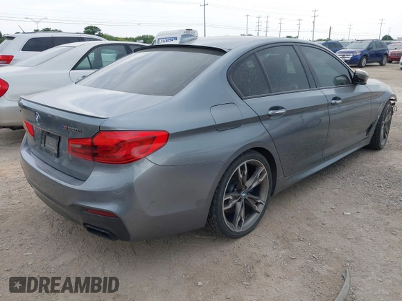 2018 BMW 5 Series M550i xDrive with VIN WBAJB9C55JB035694, listed as a IAAI auction lot 42122730 with 61,561 mi miles and . Bid and sale history available at DreamBid. Image 4.
