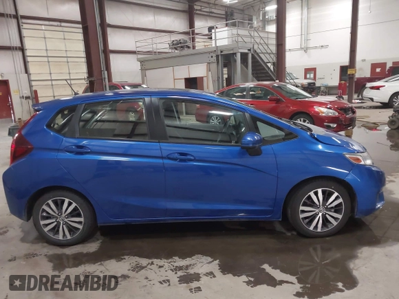 2016 Honda Fit EX z VIN JHMGK5H76GX041661, wystawiony jako IAAI lot #42162223 z przebiegiem 36 066 mil mil oraz . Historia ofert i sprzedaży dostępna na DreamBid. Obrazek 13.