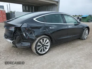 2019 Tesla Model 3 Mid Range with VIN 5YJ3E1EA7KF412426, listed as a Copart auction lot 55204205 with 73,230 mi miles and Non Repairable. Bid and sale history available at DreamBid. Image 3.