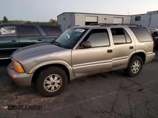 2000 GMC Jimmy SLE Convenience with VIN 1GKDT13WXY2158025, listed as a Copart auction lot 73565954 with 0 mi miles and Salvage Title. Bid and sale history available at carsss.com. Image 1.
