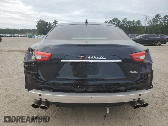 2019 Maserati Ghibli with VIN ZAM57XSS3K1319197, listed as a Copart auction lot 70454084 with 28,584 mi miles and Salvage Title. Bid and sale history available at carsss.com. Image 6.