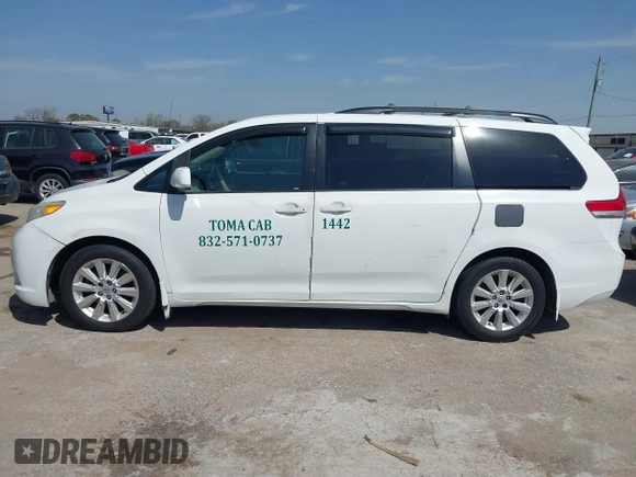 2014 Toyota Sienna LE with VIN 5TDJK3DC5ES081232, listed as a IAAI auction lot 41789629 with 397,033 mi miles and . Bid and sale history available at DreamBid. Image 14.