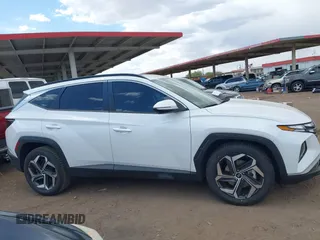2022 Hyundai Tucson SEL z VIN 5NMJF3AE2NH062926, wystawiony jako IAAI lot #41969902 z przebiegiem 41 882 mil mil oraz . Historia ofert i sprzedaży dostępna na DreamBid. Obrazek 13.