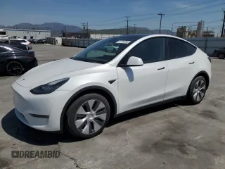 2022 Tesla Model Y Long Range z VIN 7SAYGDEE2NF513823, wystawiony jako Copart lot #51174795 z przebiegiem 28 143 mil mil oraz Szkody całkowita. Historia ofert i sprzedaży dostępna na DreamBid. Obrazek 1.
