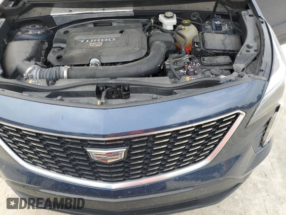 2022 Cadillac XT4 FWD Luxury z VIN 1GYAZAR47NF120348, wystawiony jako Copart lot #50187025 z przebiegiem 76 886 mil mil oraz Nie do naprawy • Non repairable. Historia ofert i sprzedaży dostępna na DreamBid. Obrazek 12.