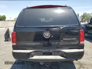 2002 Cadillac Escalade z VIN 1GYEC63T42R189976, wystawiony jako Copart lot #57852565 z przebiegiem 243 089 mil mil oraz Szkody całkowita. Historia ofert i sprzedaży dostępna na DreamBid. Obrazek 6.