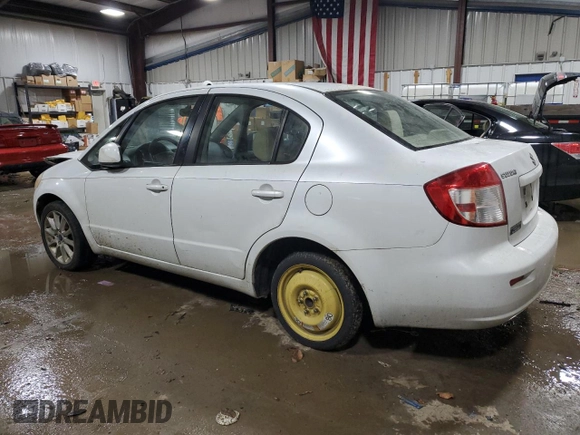 2011 Suzuki SX4 LE z VIN JS2YC5A29B6302397, wystawiony jako Copart lot #82691304 z przebiegiem 251 382 mil mil oraz Szkoda całkowita • Salvage title. Historia ofert i sprzedaży dostępna na DreamBid. Obrazek 2.