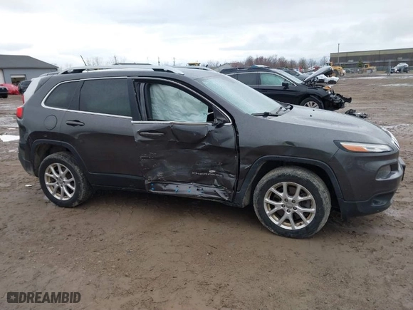 2014 Jeep Cherokee Latitude with VIN 1C4PJLCS2EW319267, listed as a IAAI auction lot 41846074 with 129,668 mi miles. Bid and sale history available at carsss.com. Image 13.