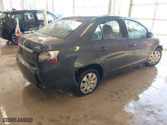 2010 Toyota Yaris with VIN JTDBT4K38A1355010, listed as a IAAI auction lot 41563391 with 154,835 mi miles. Bid and sale history available at carsss.com. Image 4.