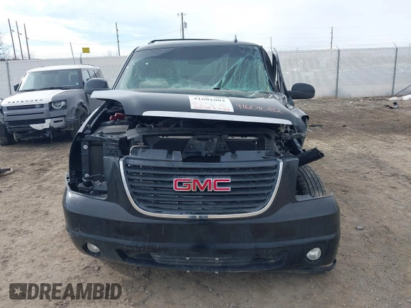 2011 GMC Yukon SLT with VIN 1GKS2CE02BR365229, listed as a IAAI auction lot 41601082 with 203,739 mi miles. Bid and sale history available at carsss.com. Image 12.