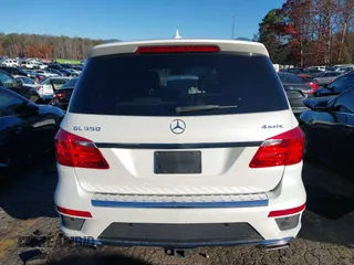 2016 Mercedes-Benz GL with VIN 4JGDF7DE6GA703049, listed as a IAAI auction lot 41063570 with 116,736 mi miles. Bid and sale history available at carsss.com. Image 16.