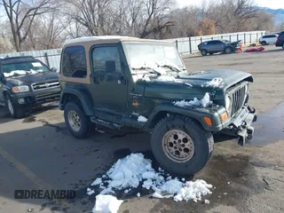 1998 Jeep Wrangler Sahara z VIN 1J4FY49S3WP744619, wystawiony jako IAAI lot #41107702 z przebiegiem 105 432 mil mil oraz . Historia ofert i sprzedaży dostępna na DreamBid. Obrazek 1.
