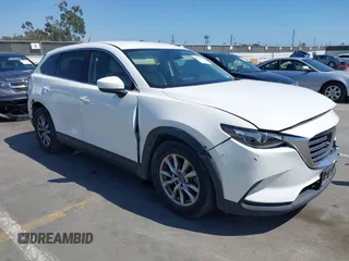 2019 Mazda CX-9 Touring with VIN JM3TCACY5K0306424, listed as a IAAI auction lot 42150466 with 95,166 mi miles and . Bid and sale history available at DreamBid. Image 1.